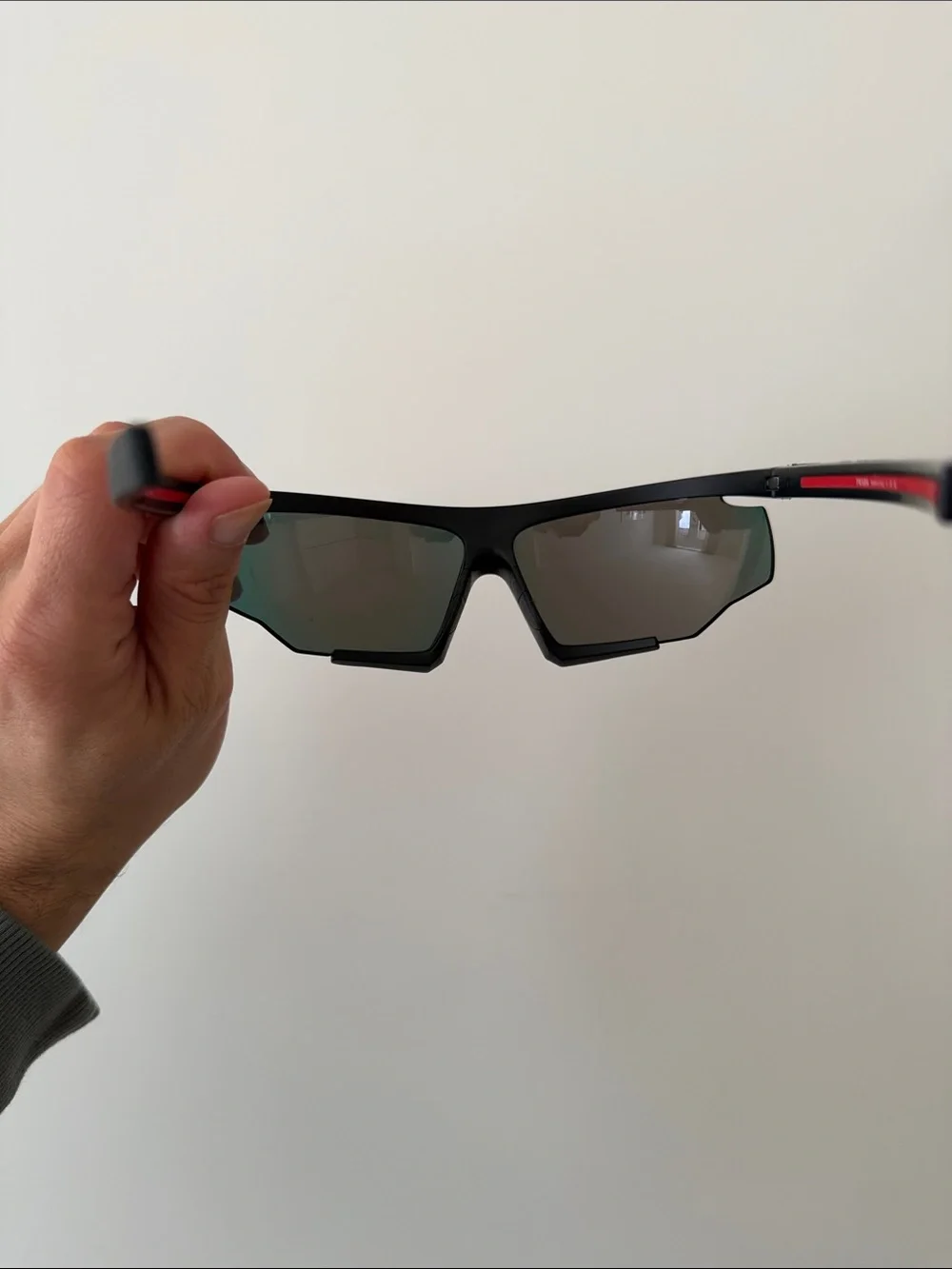 Prada Sports Sunglasses with Red Mirrored Lenses